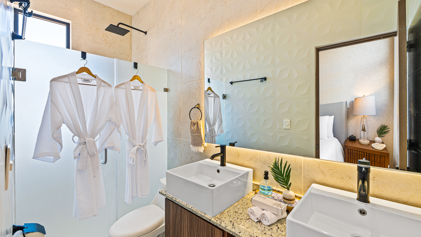 Primary ensuite bathroom with dual sinks