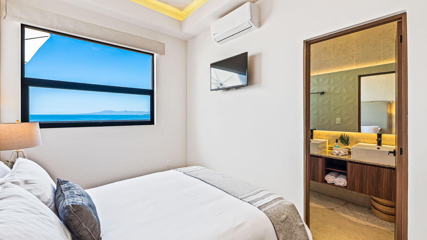 Primary bedroom with queen bed